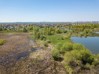 Fototapeta na wymiar River bank in spring. Aerial drone view.