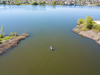 Fishing boat on the river. Aerial drone view.