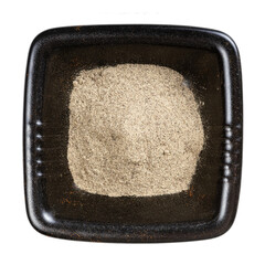 view of ground black pepper in black bowl isolated