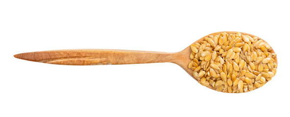 top view of wood spoon with golden flax seeds