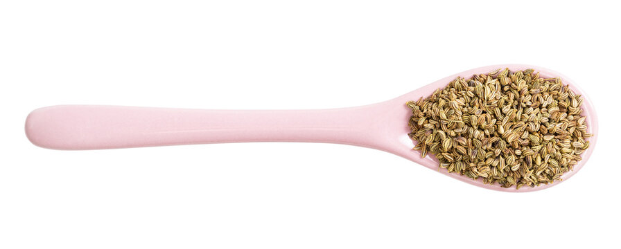 ceramic spoon with ajwain seeds isolated
