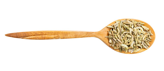 top view of wood spoon with fennel seeds isolated
