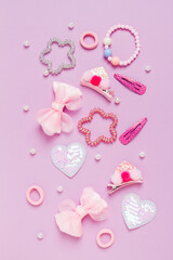 Little girl accessories lifestyle set on lilac and background.