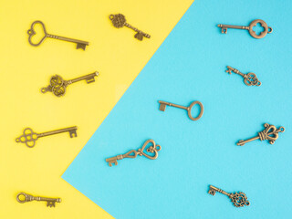 Eleven bronze antique key on blue and yellow background