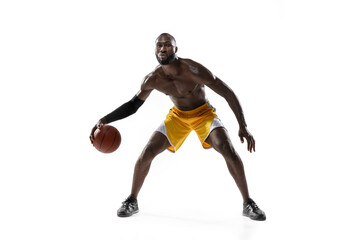 Full length portrait of a basketball player with a ball isolated on white studio background. advertising concept. Fit african american athlete jumping with ball.