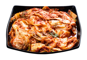 korean appetizer kimchi in black bowl isolated