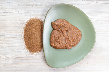 top view of teff grains and boiled porridge