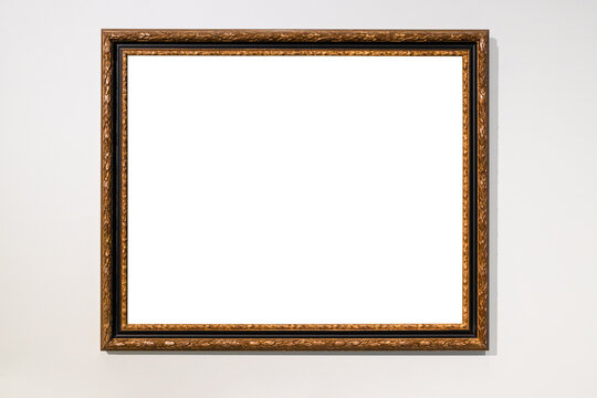 old dark brown picture frame on gray wall