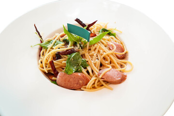 Fried spaghetti with dried chili on white background
