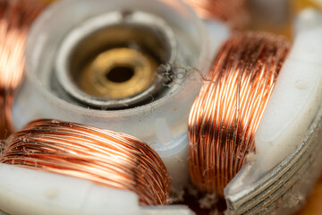 Computer fan rotor with copper coils winding and ball bearing dismantled.