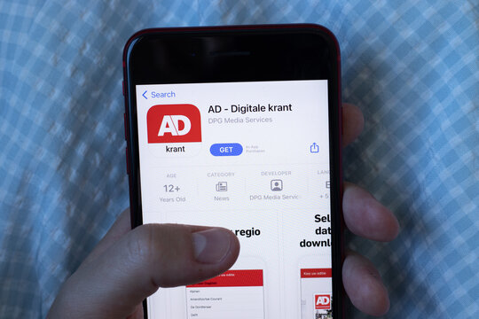 New York, USA - 1 June 2021: AD - Digitale krant mobile app logo on phone screen, close-up icon, Illustrative Editorial.