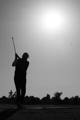 Black and white silhouette of golf player with copy space