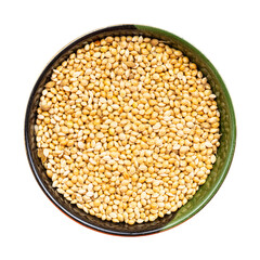 unpolished yellow proso millet in bowl isolated