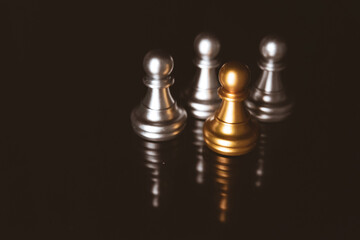 Closeup of chess characters on board games. to represent decision making in term of business strategy to find out the best solution to meet target objective and goal.	