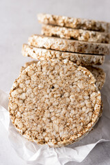 Round Crisp Healthy Gluten Free Buckwheat Crispbread on Light Gray Background Close Up Vertical