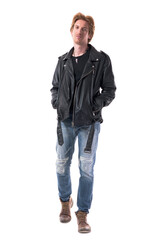 Fototapeta premium Satisfied confident young man in leather jacket walking and smirk smiling. Full body length isolated on white background.