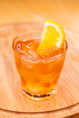 Alcoholic cocktail on wooden board