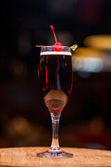 Alcoholic cocktail on wooden board