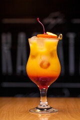 Alcoholic cocktail on wooden board