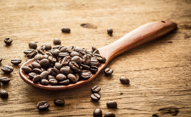 coffee beans in a wooden spoon
