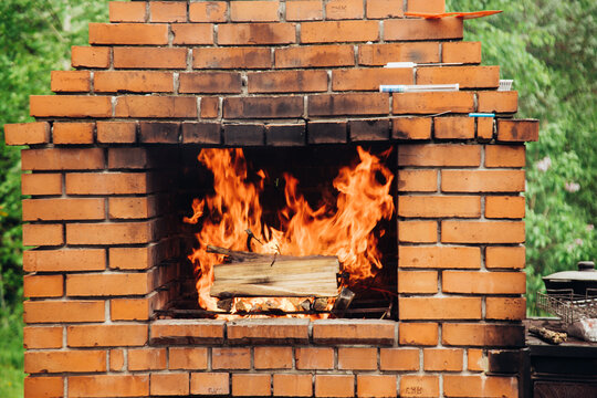 Stone garden oven for grill or barbeque is in a backyard