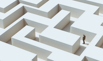 businessman walks in a maze. challenge concept.