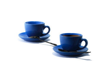Blue tea cups and tea saucers with iron teaspoons isolated on white background