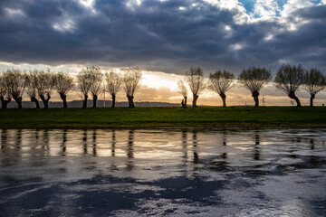 Fototapeta premium Country landscape on river at sunset, Germany