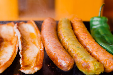 Grilled sausages with pork loin and green peppers