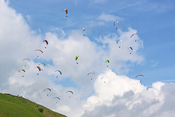 Paragliders in a blue sky	