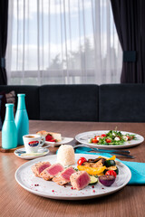 Medium grilled tuna steak with vegetables