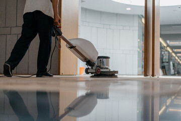 Fototapeta premium cleaning floor with machine