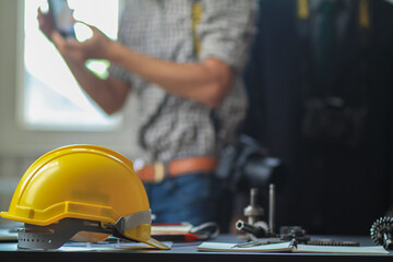 Hard yellow plastic helmets or helmets that are placed on the workbench of the engineering team for the safety of the work site. A safety helmet is a basic safety equipment for workers.