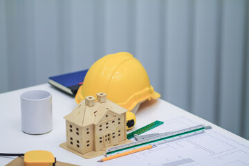 Plans and documents are placed on desks in the engineering team's office to prepare for the meeting...