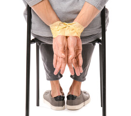 Male hostage on white background, closeup