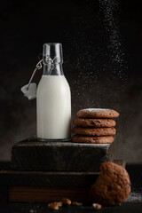 oatmeal cookies and a bottle of milk