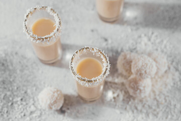 Irish cream or Coffee Liqueur with homemade coconut healthy balls and coco flakes