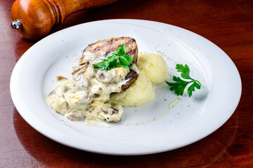 Comfort home cooked food - grilled pork, mashed potatoes with creamy mushroom sauce