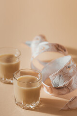 Short glasses of Irish cream Liquor or Coffee Liqueur with ribbon