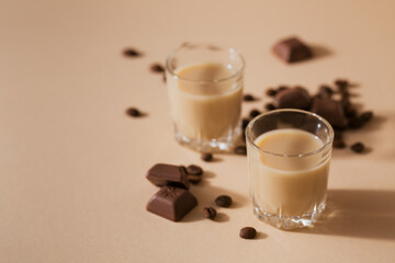 Short glasses of Irish cream Liquor or Coffee Liqueur with chocolat and coffee beans