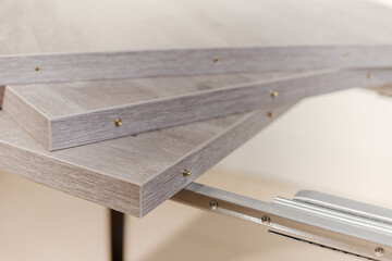 Extendable dinning table. Slide gear close up view