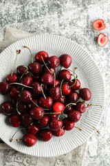 cherry with splashes on a gray background