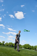 Boy teenager 16 years old launches a glider plane into the sky