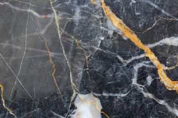 White and gold patterned structure of gray marble (Gold Russia) texture. Abstract dark background