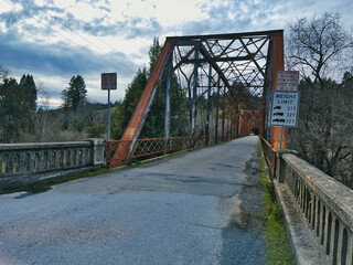 Old steel bridge on remote country road 