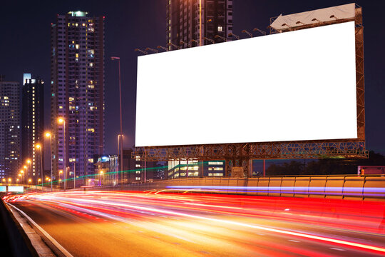 blank billboard on light trails, street, city and urban in the night - can advertisement for display or montage product or business