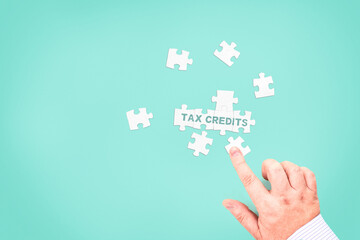 Fototapeta premium A businessman collects the text 