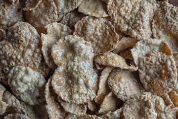 Whole grain glazed flakes in plate. Healthy breakfast, whole grain muesli in a bowl
