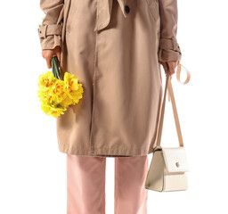 Naklejka premium Beautiful young woman with narcissus bouquet on white background