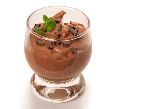 Vegan chocolate mousse glass isolated on white background.